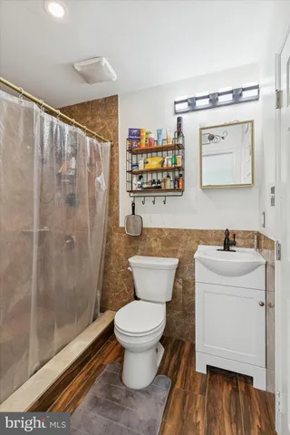 a kitchen with stainless steel appliances a stove a sink and a refrigerator
