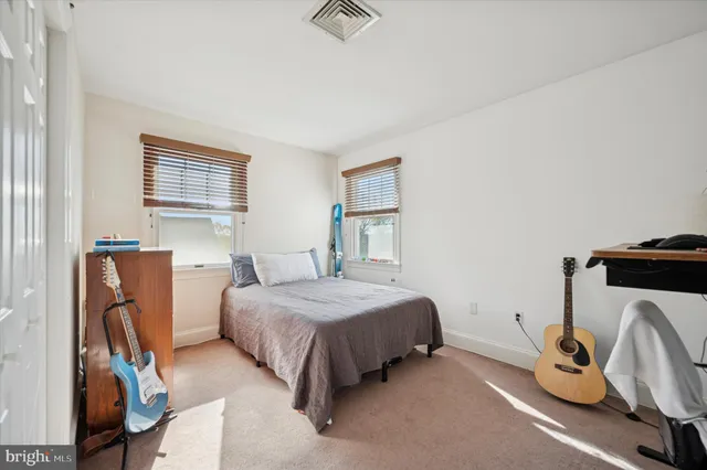 a view of a balcony with wooden floor and fence