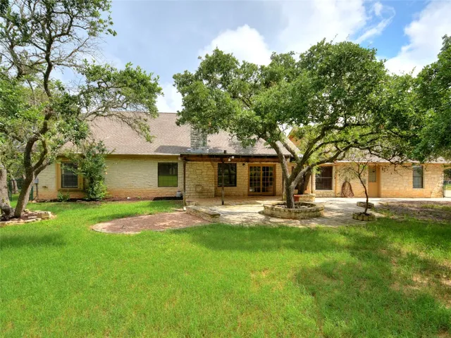 a view of a yard with a tree