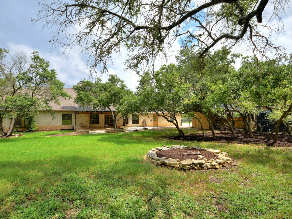 328 Fawnridge Street Georgetown, TX 78628 - Photo 33 of 36 a view of a backyard with a garden