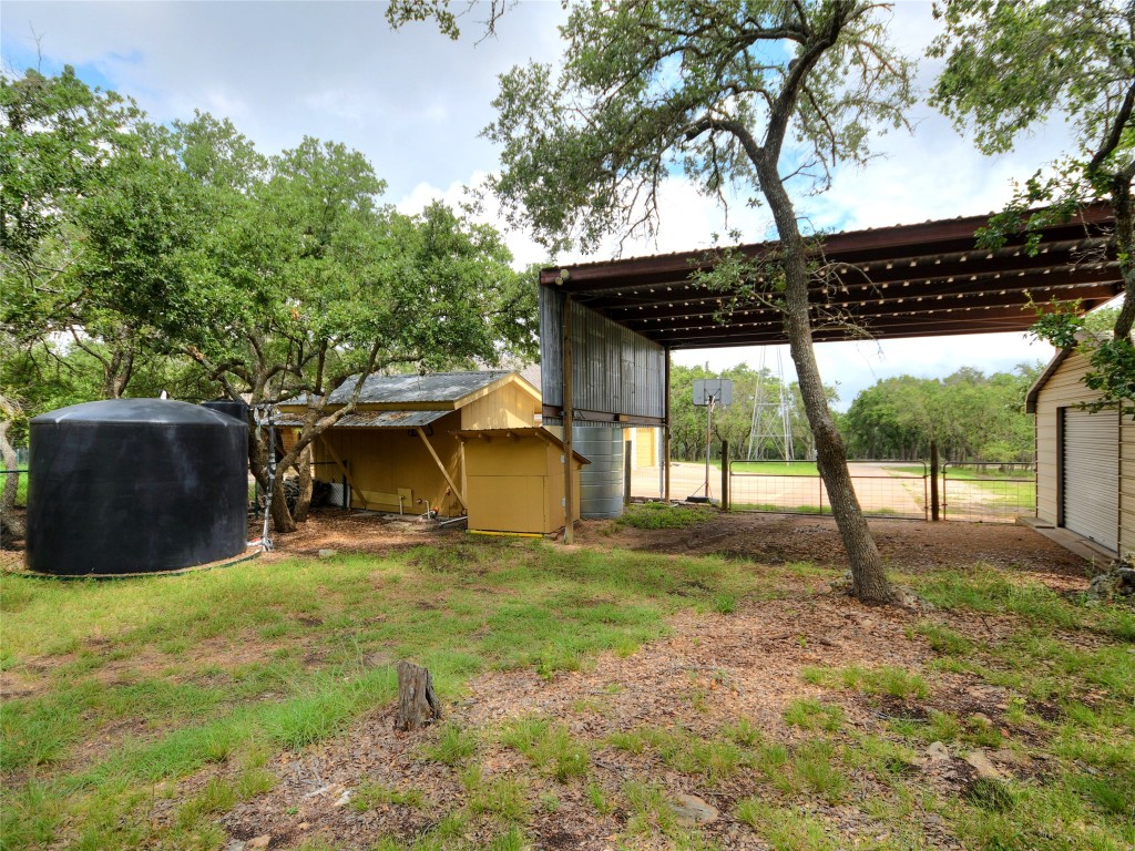328 Fawnridge Street Georgetown, TX 78628 - Photo 35 of 36 a view of a couches under an umbrella