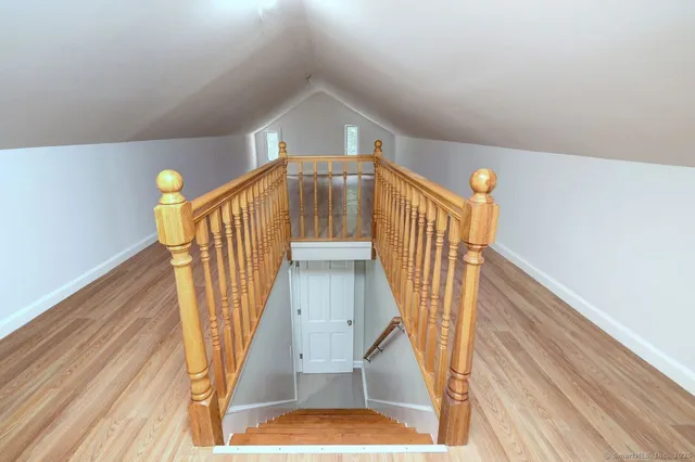 a view of entryway wooden floor and front door