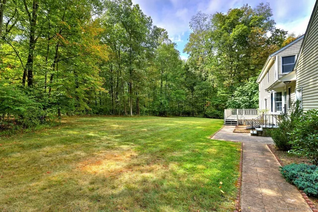 a view of a patio with table and chairs and potted plants