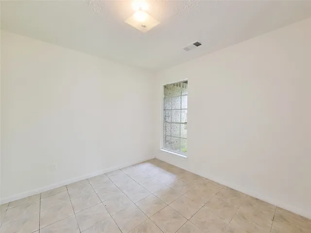 a view of a room that has a window in it