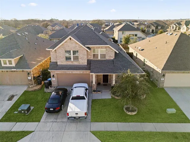an aerial view of a house with patio