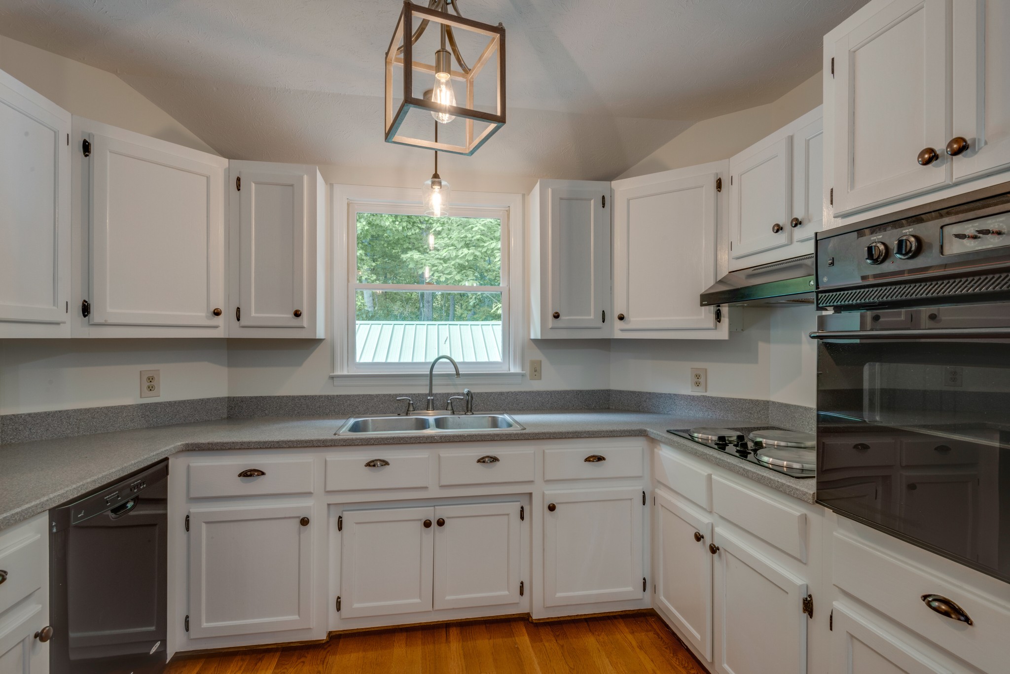 146 Howard Road White Bluff, TN 37187 - Photo 11 of 25 a kitchen with stainless steel appliances white cabinets and a sink