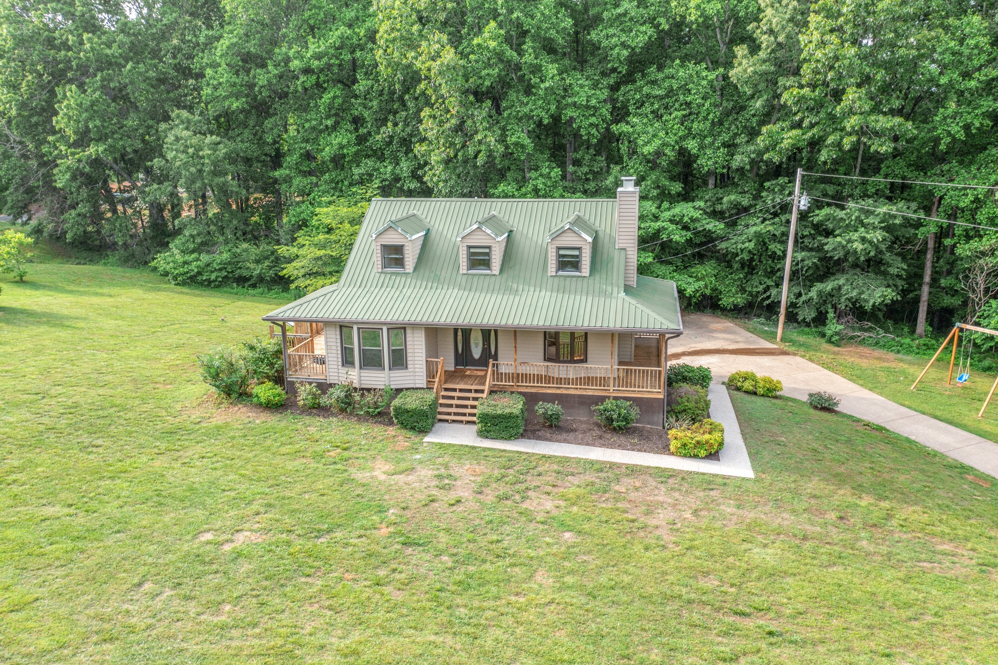 146 Howard Road White Bluff, TN 37187 - Photo 18 of 25 an aerial view of a house with swimming pool and a yard