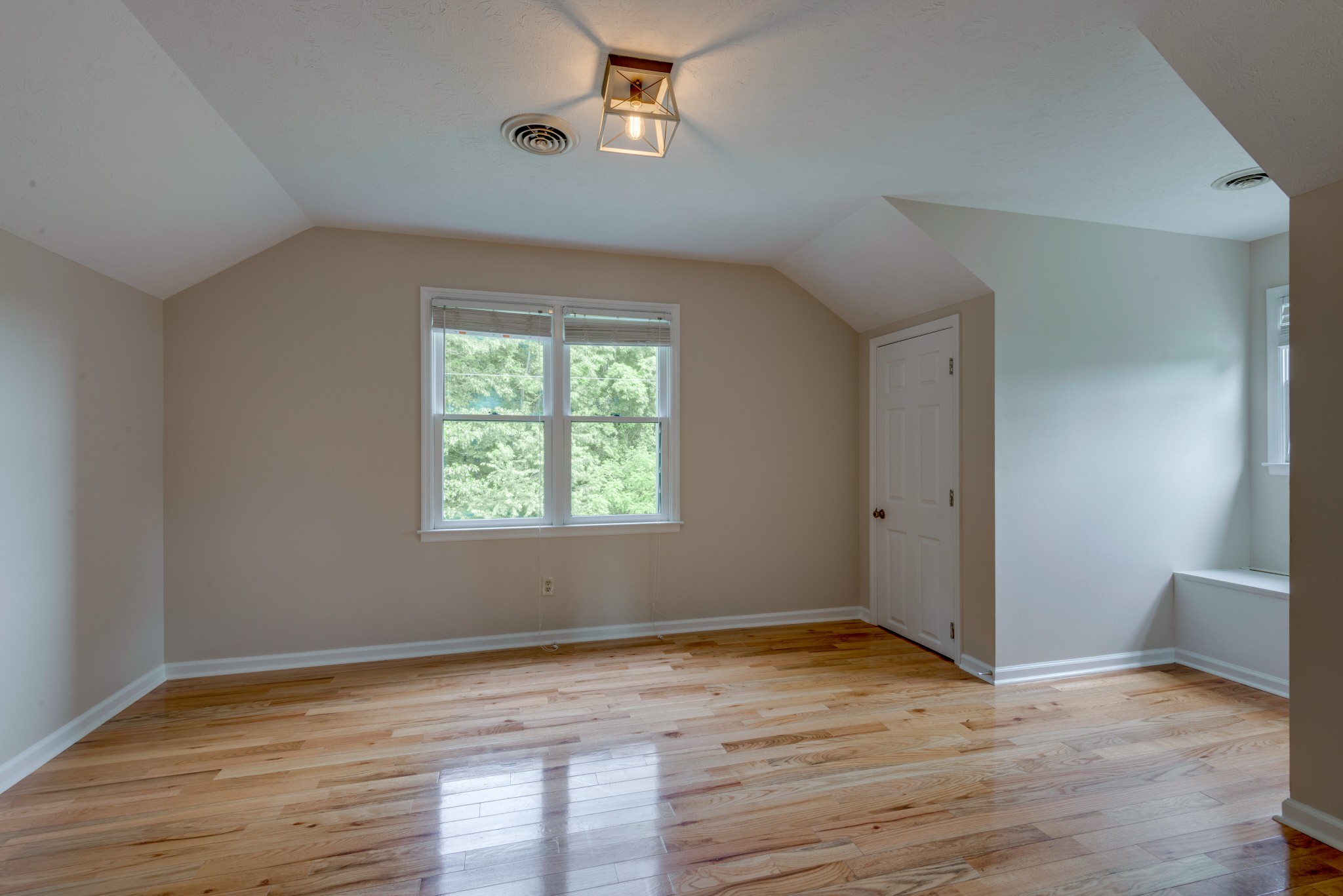 146 Howard Road White Bluff, TN 37187 - Photo 19 of 25 a view of an empty room with wooden floor and a window
