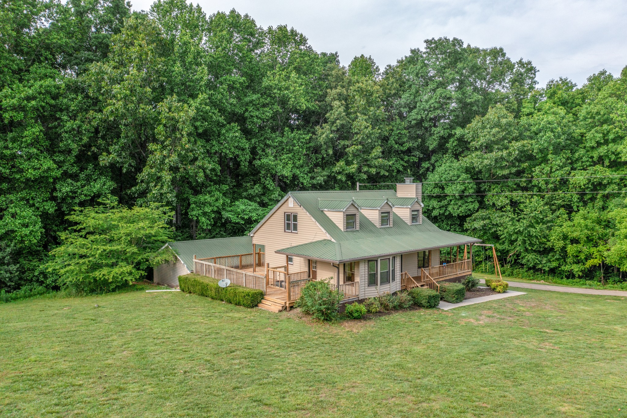 146 Howard Road White Bluff, TN 37187 - Photo 2 of 25 a front view of a house with garden