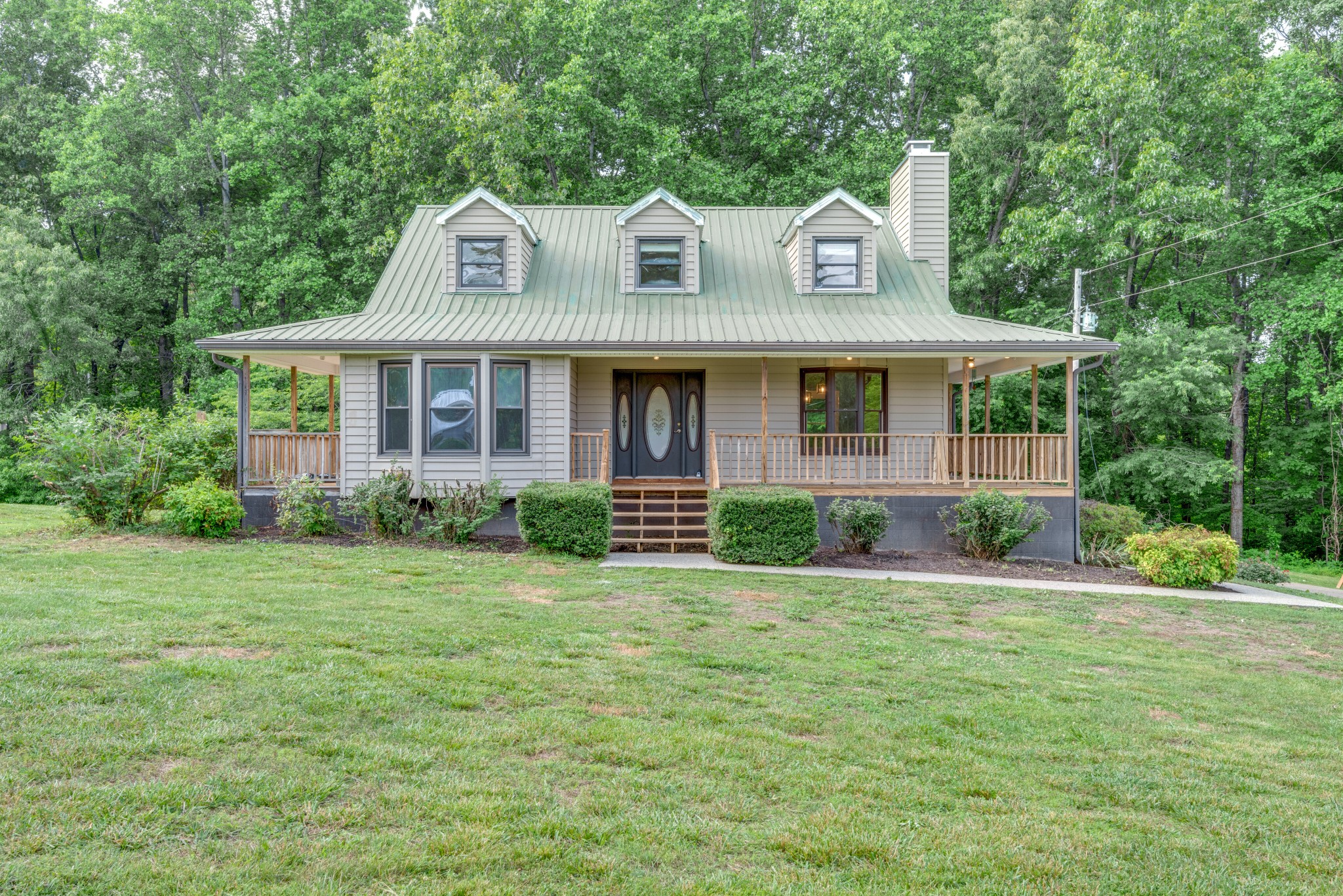 146 Howard Road White Bluff, TN 37187 - Photo 3 of 25 a front view of a house with a yard
