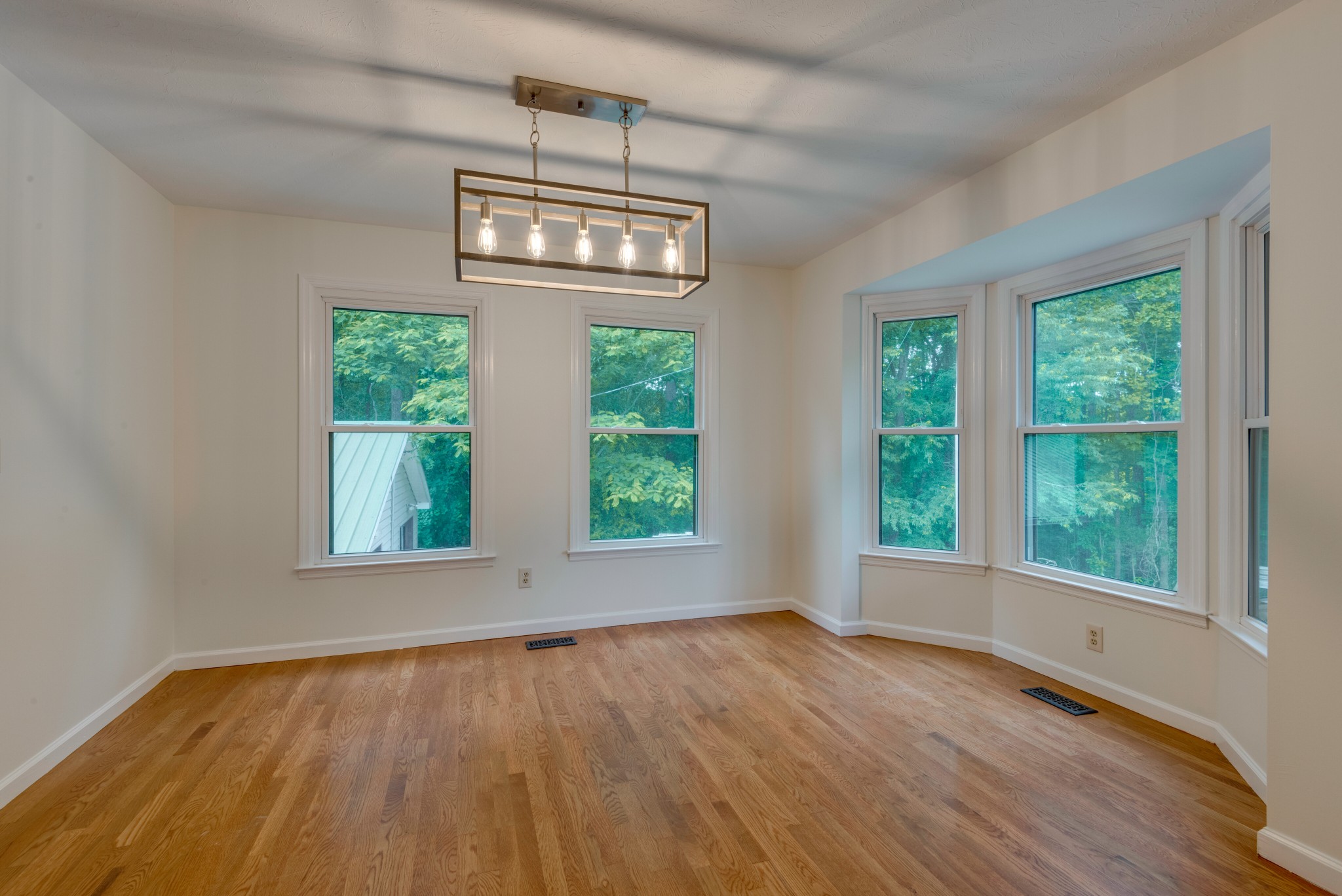 146 Howard Road White Bluff, TN 37187 - Photo 4 of 25 a view of an empty room with wooden floor and a window