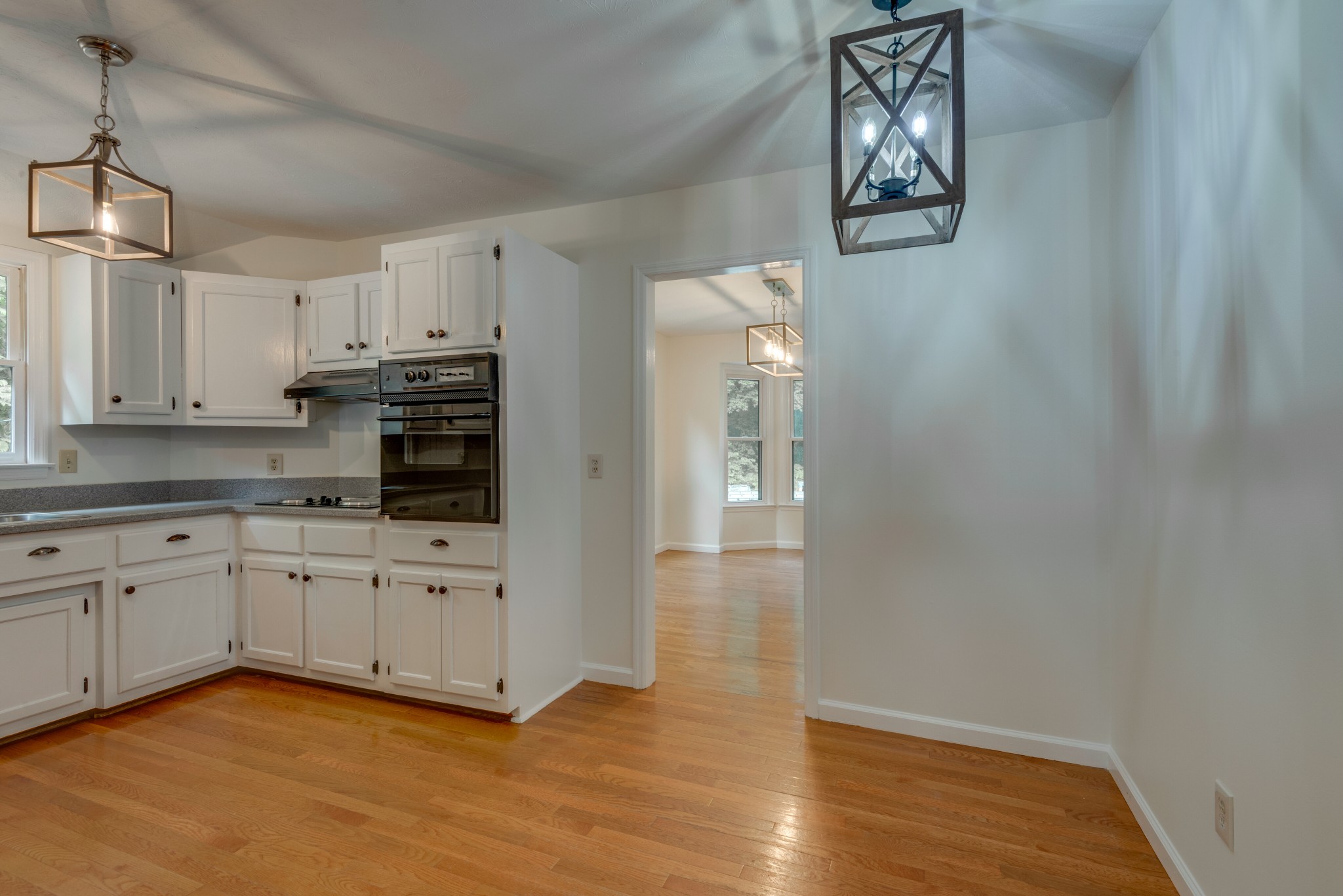 146 Howard Road White Bluff, TN 37187 - Photo 9 of 25 a kitchen with cabinets and wooden floor