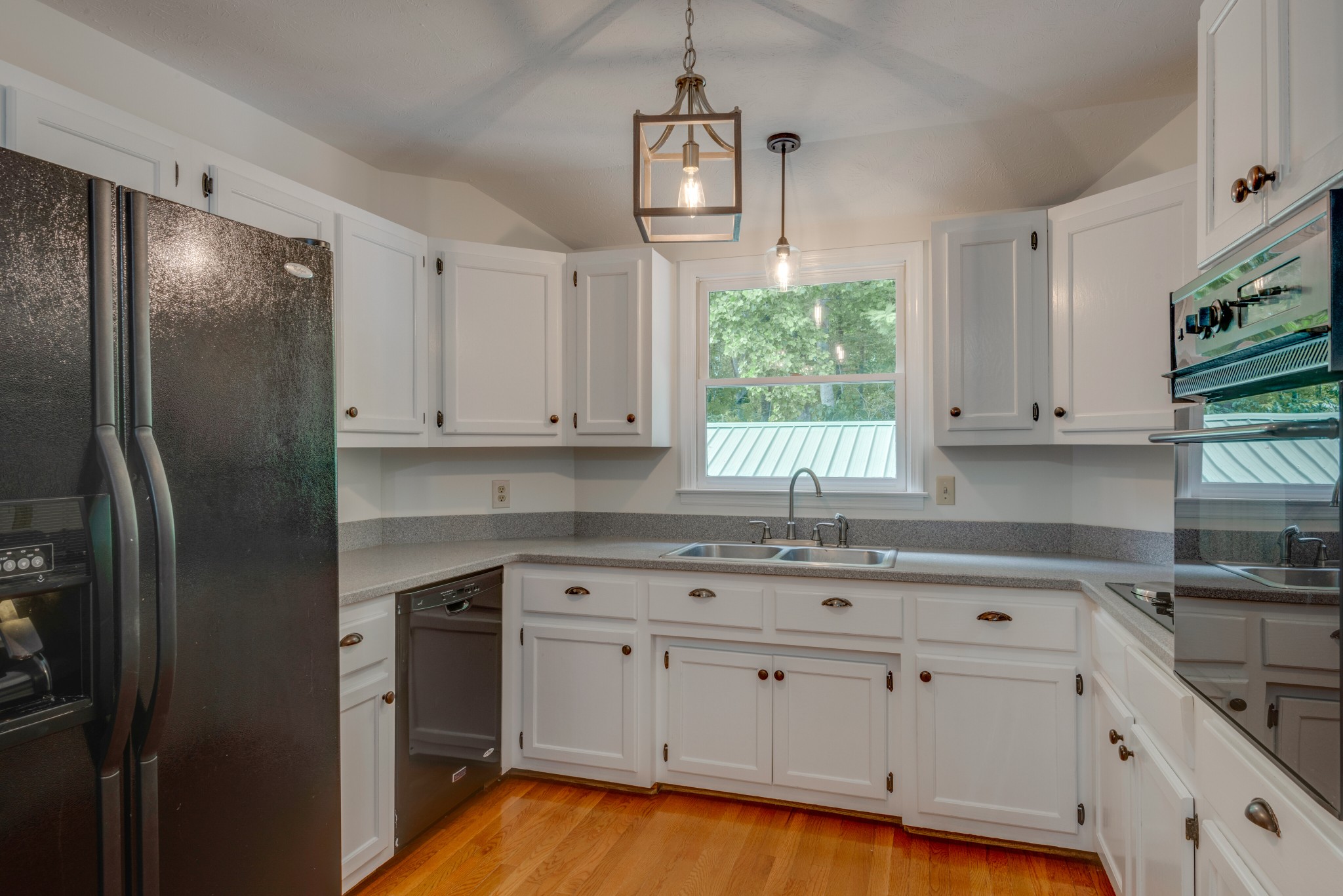 146 Howard Road White Bluff, TN 37187 - Photo 10 of 25 a kitchen with white cabinets and window