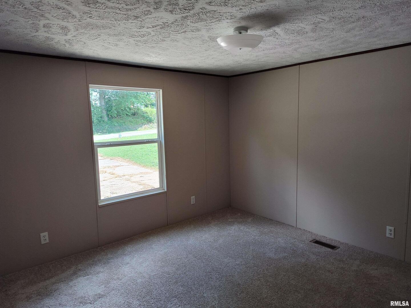531 Cemetery Road Grayville, IL 62844 - Photo 12 of 18 an empty room with a window