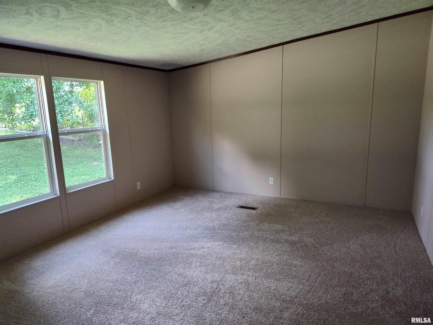 531 Cemetery Road Grayville, IL 62844 - Photo 13 of 18 an empty room with a window