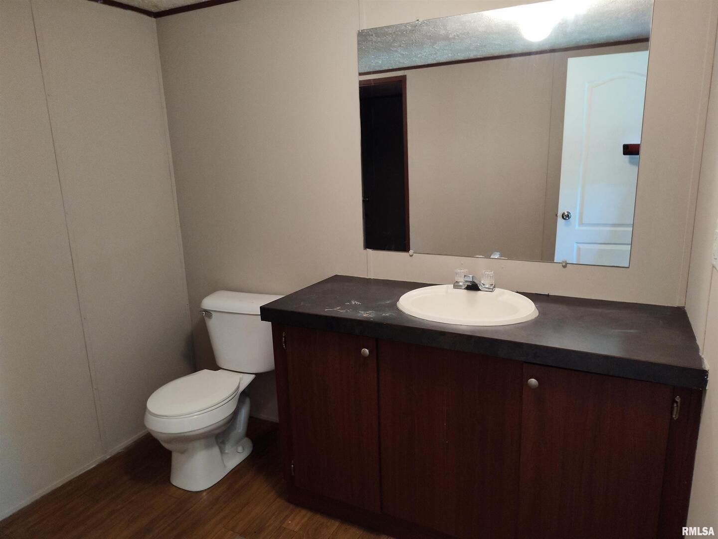 531 Cemetery Road Grayville, IL 62844 - Photo 14 of 18 a bathroom with a sink and a toilet