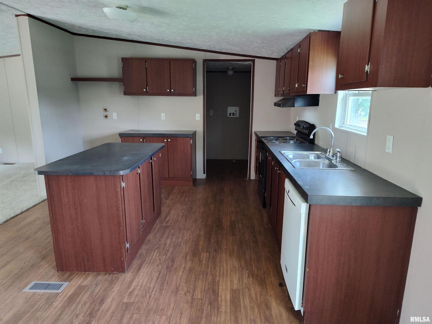 531 Cemetery Road Grayville, IL 62844 - Photo 7 of 18 a kitchen with stainless steel appliances granite countertop a sink stove and cabinets