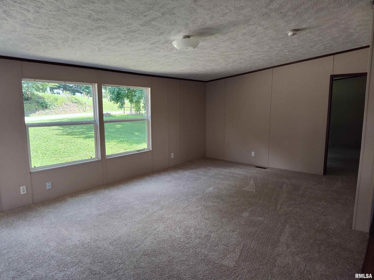 531 Cemetery Road Grayville, IL 62844 - Photo 8 of 18 a view of an empty room with a window