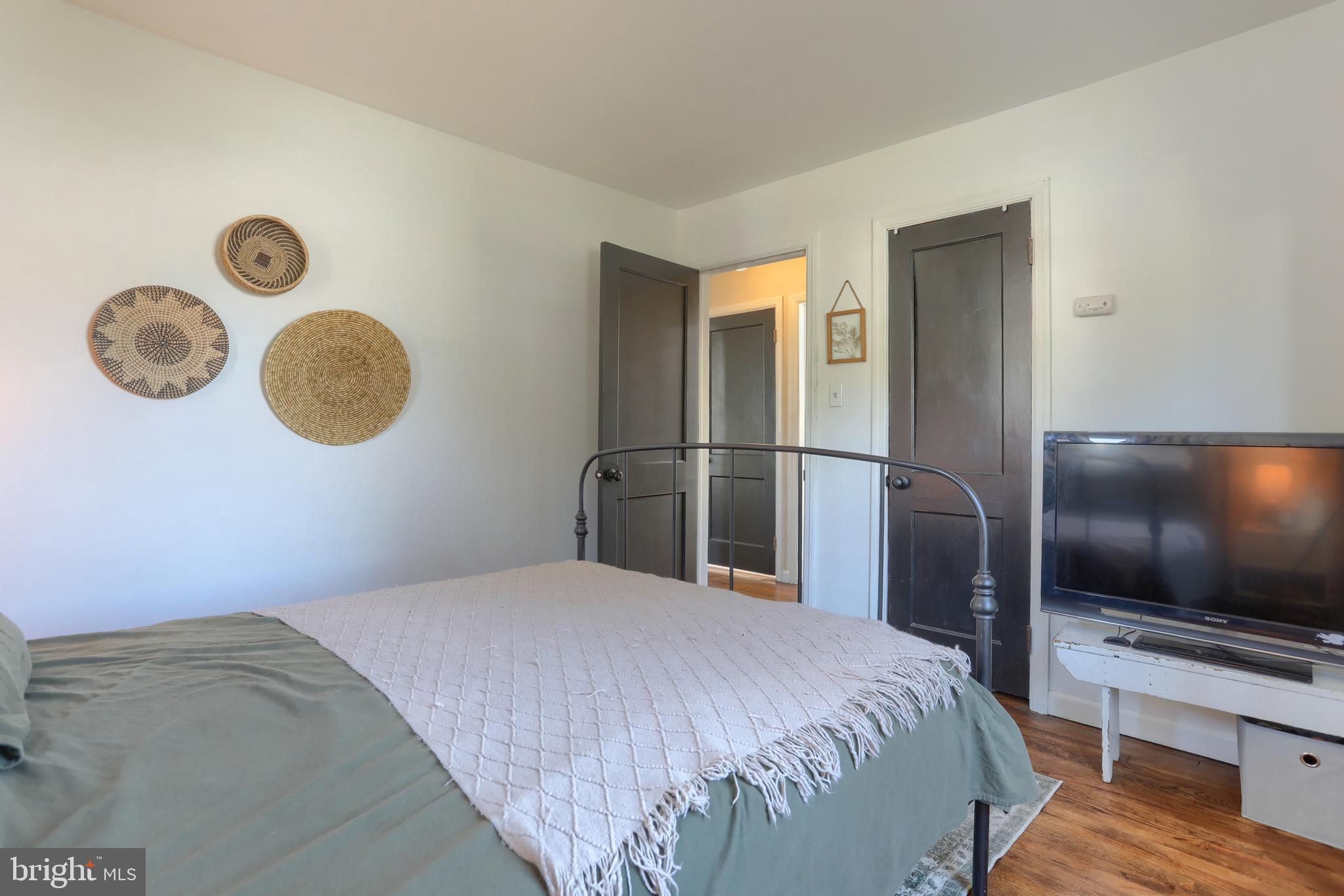 517 South 5th Street Lebanon, PA 17042 - Photo 14 of 29 a bedroom with a bed and a floor to ceiling window