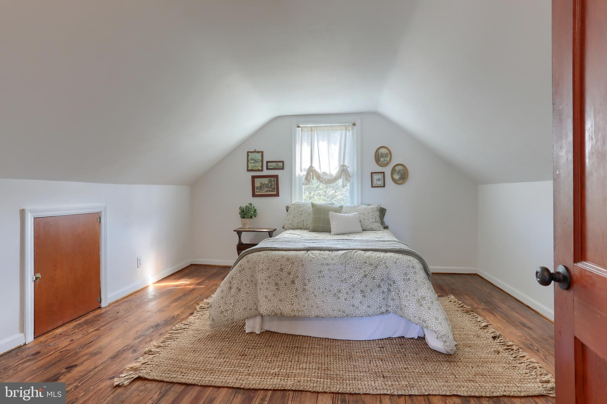 517 South 5th Street Lebanon, PA 17042 - Photo 18 of 29 a spacious bedroom with a bed and wooden floor
