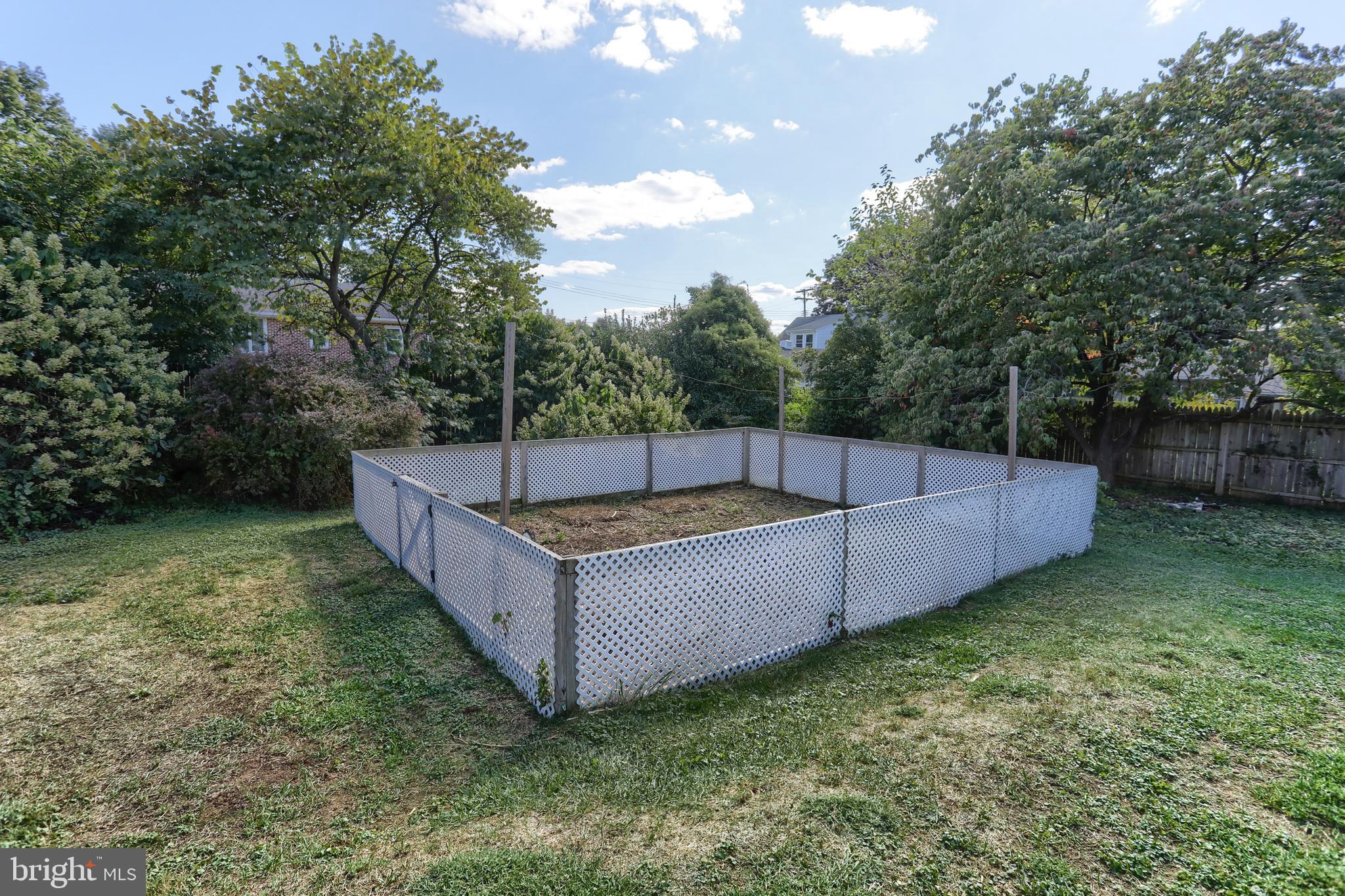 517 South 5th Street Lebanon, PA 17042 - Photo 23 of 29 a view of a backyard with a large tree and wooden fence