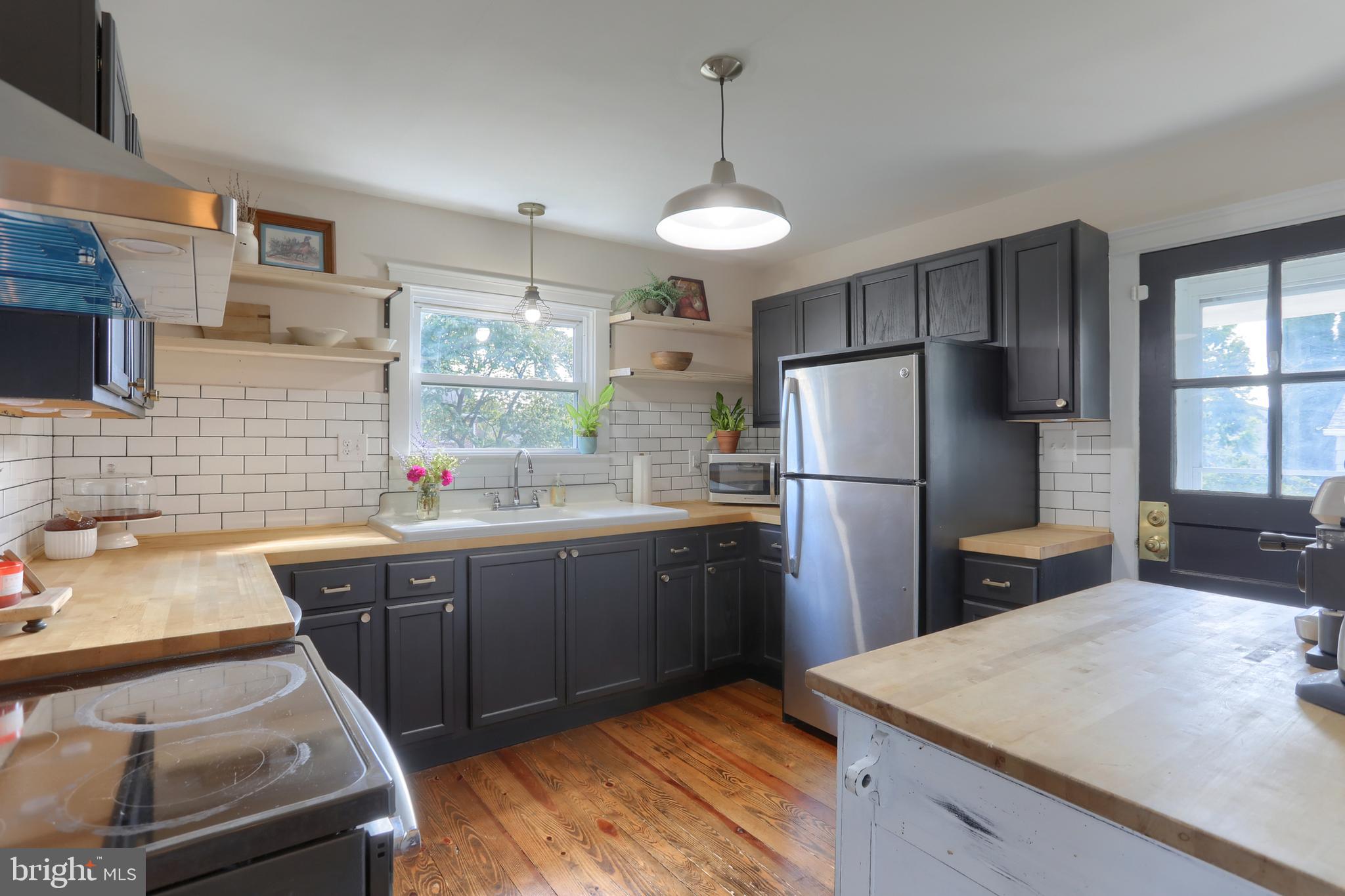 517 South 5th Street Lebanon, PA 17042 - Photo 10 of 29 a kitchen with a sink refrigerator and microwave
