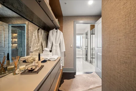 a bathroom with a sink a mirror and a shower