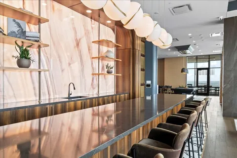 a hallway with wooden floor and furniture