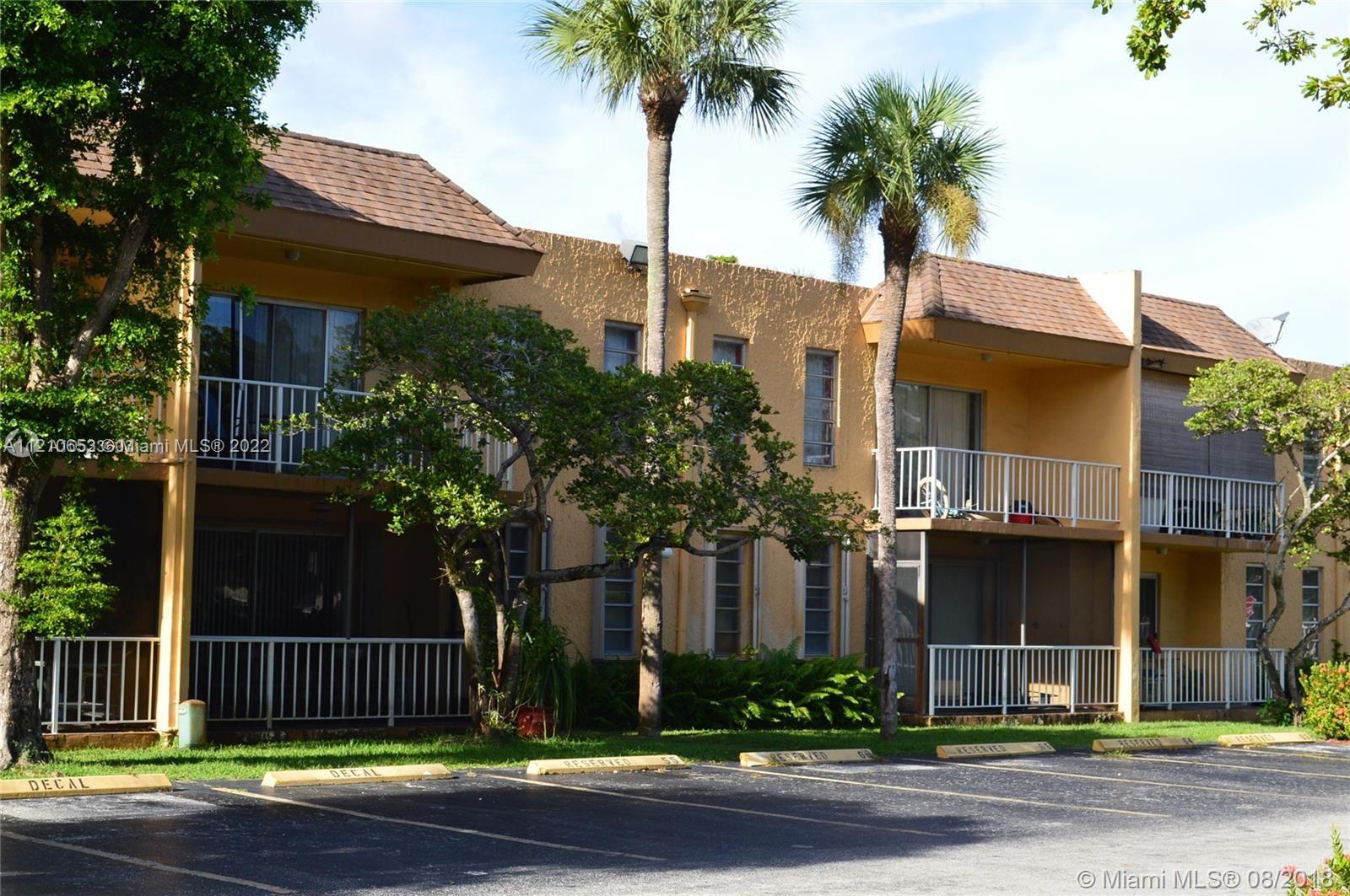 13700 Southwest 62nd Street, Unit 149 Miami, FL 33183 - Photo 2 of 36 a front view of a house with garage and plants