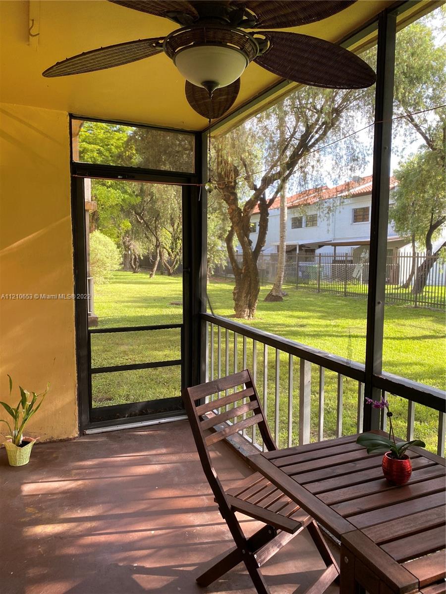 13700 Southwest 62nd Street, Unit 149 Miami, FL 33183 - Photo 29 of 36 a view of a wooden deck with a yard
