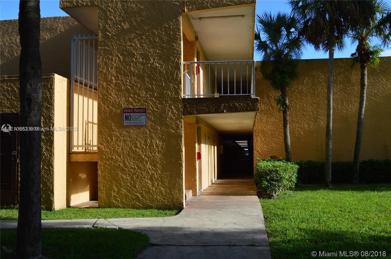 13700 Southwest 62nd Street, Unit 149 Miami, FL 33183 - Photo 3 of 36 a front view of a house with a yard