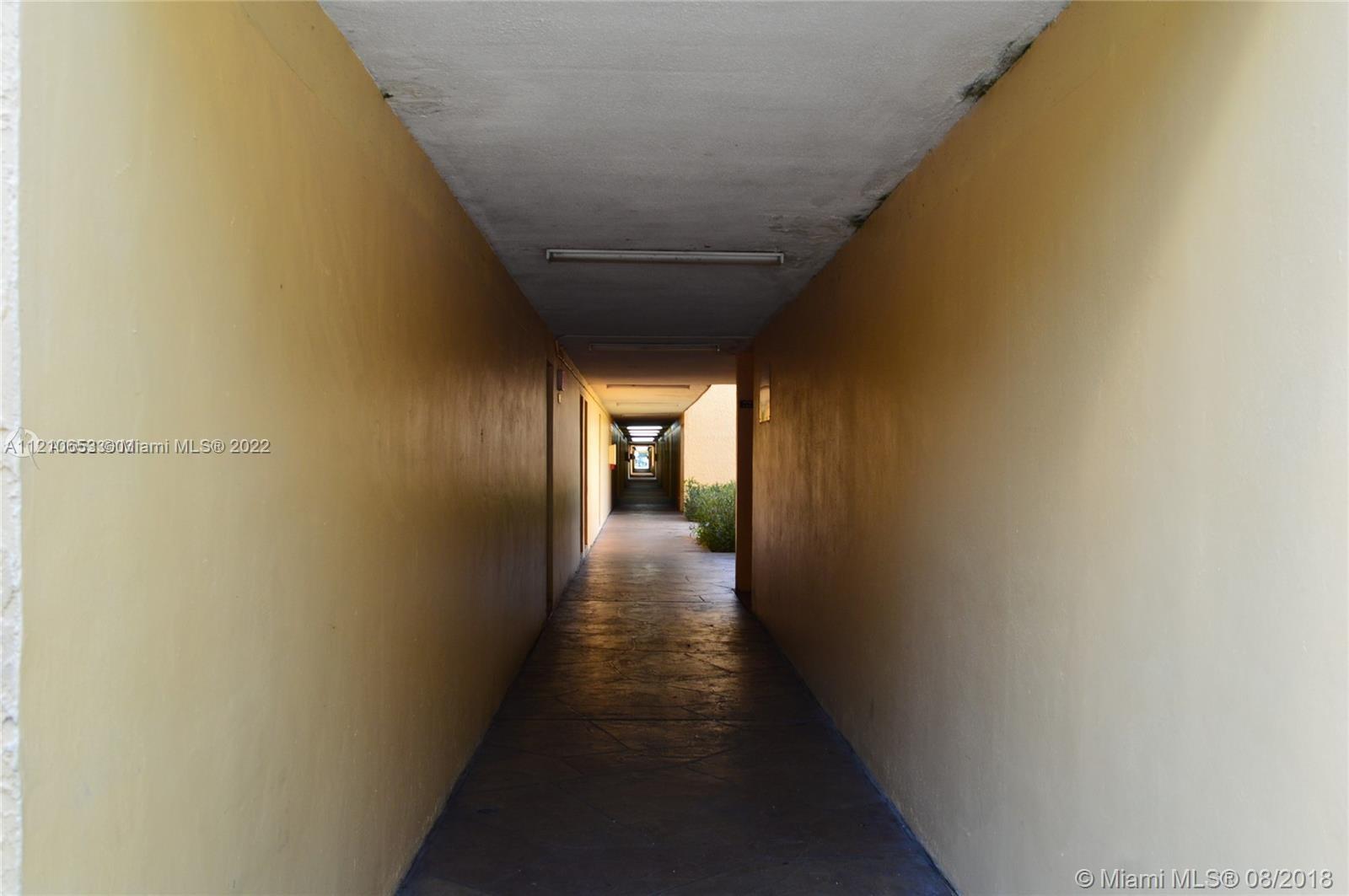 13700 Southwest 62nd Street, Unit 149 Miami, FL 33183 - Photo 31 of 36 a view of a hallway