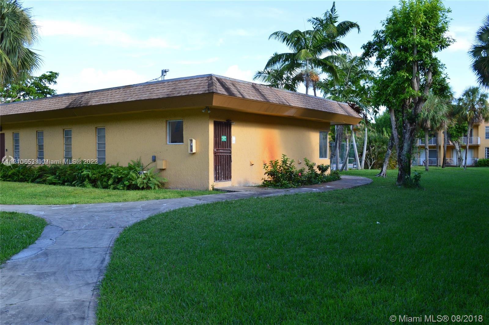 13700 Southwest 62nd Street, Unit 149 Miami, FL 33183 - Photo 36 of 36 a front view of a house with garden