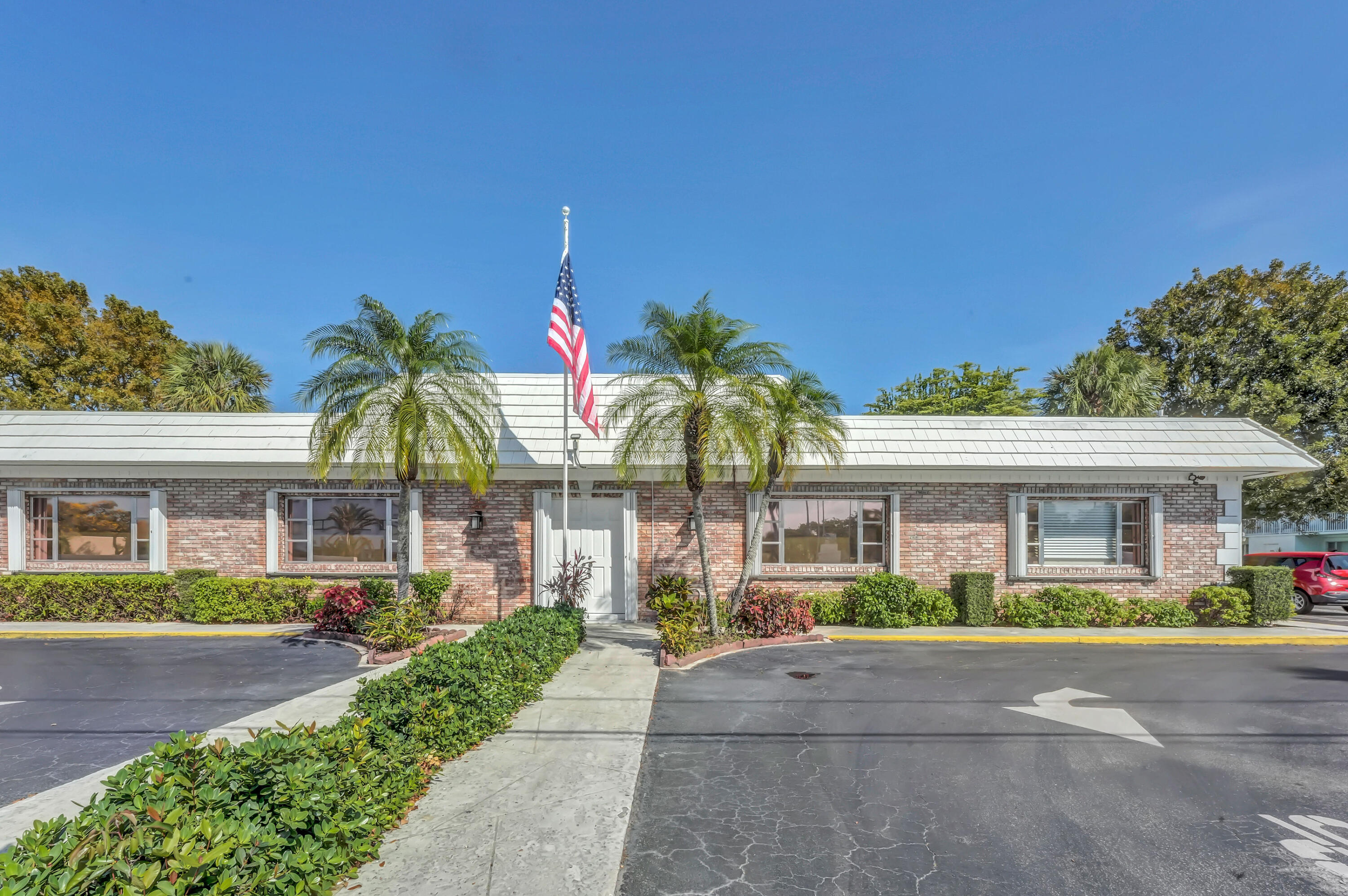 406 South Cypress Road, Unit 330 Pompano Beach, FL 33060 - Photo 28 of 38 a front view of building with yard
