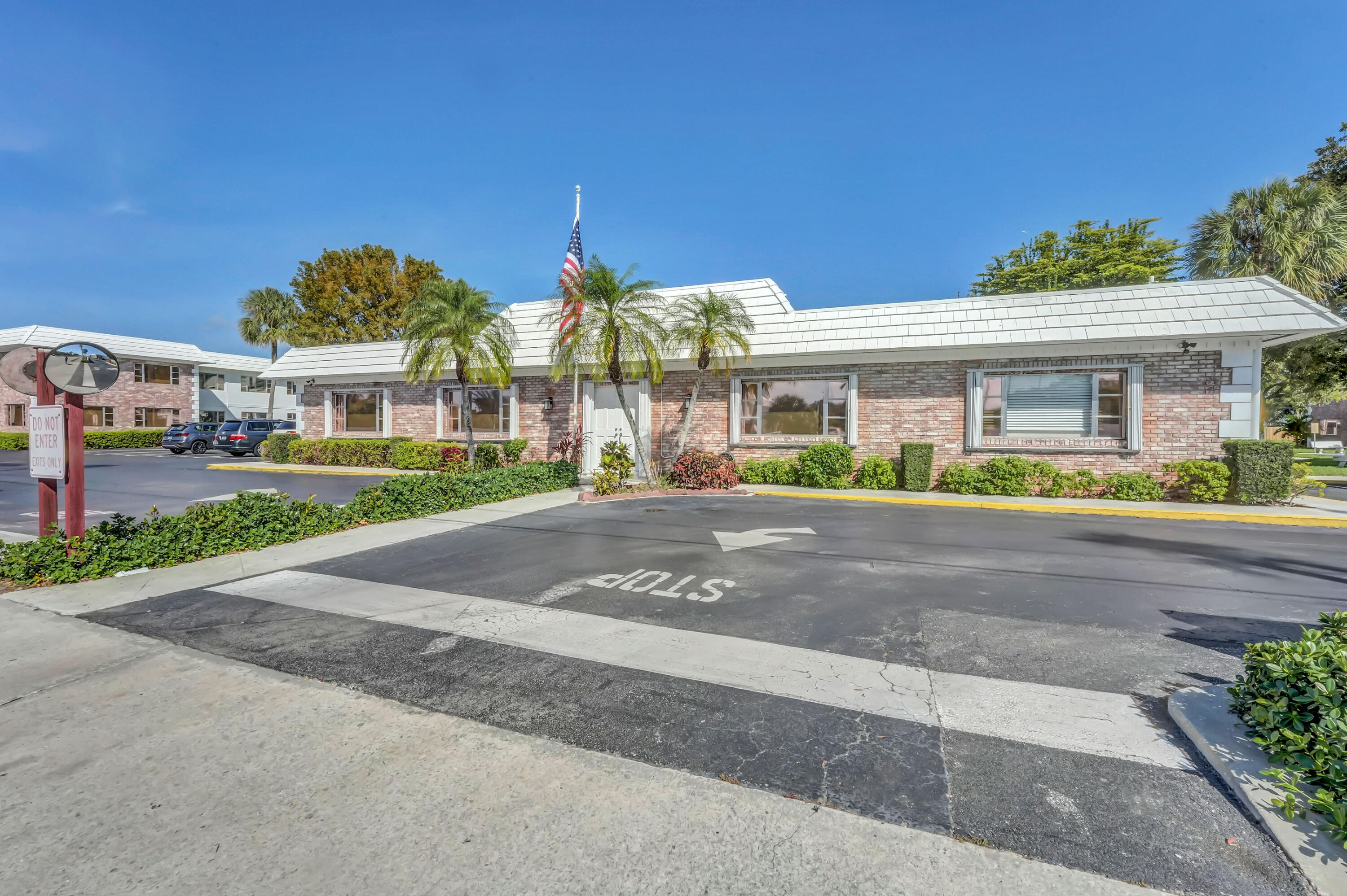 406 South Cypress Road, Unit 330 Pompano Beach, FL 33060 - Photo 29 of 38 front view of a house with a street