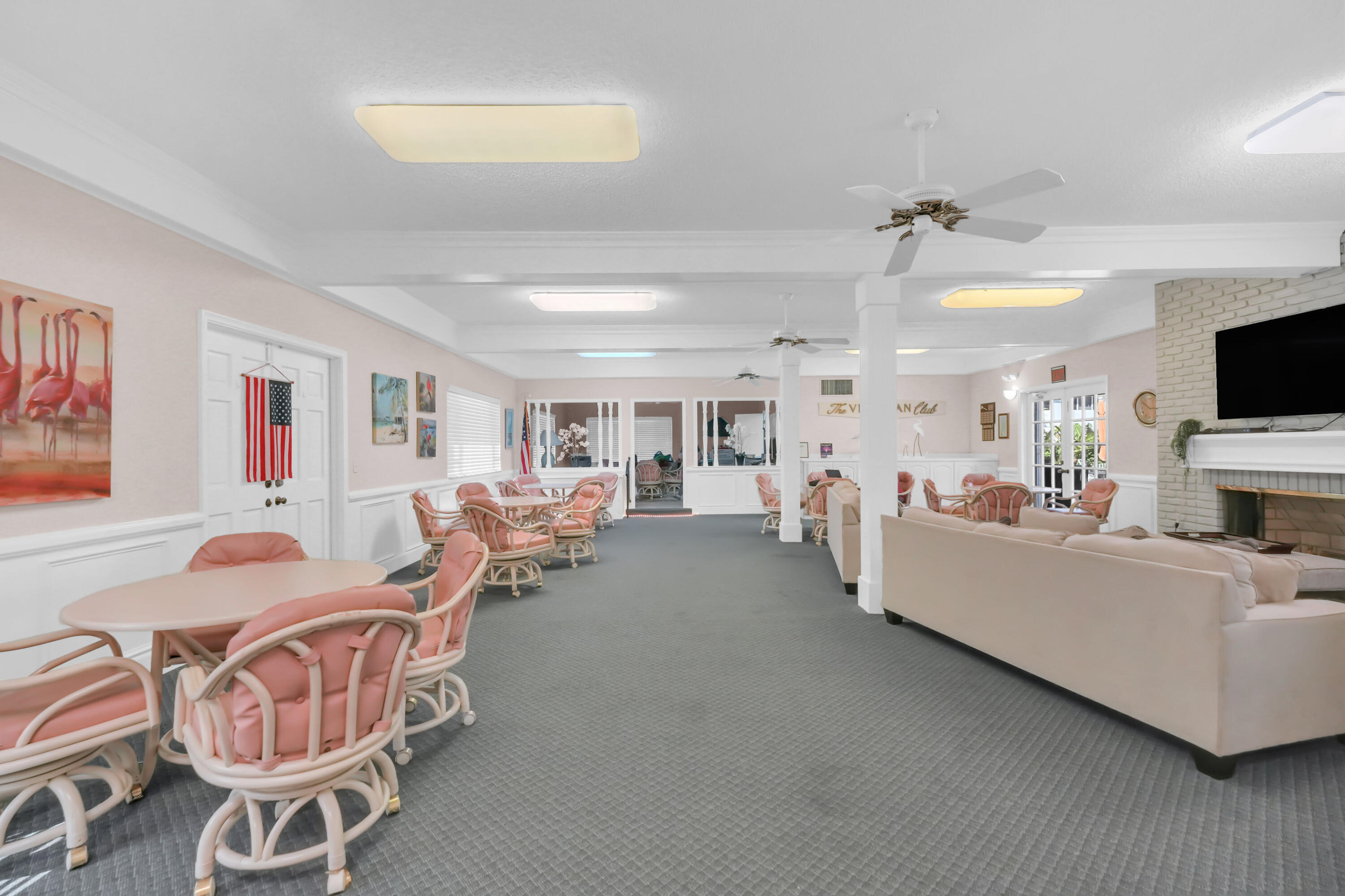 406 South Cypress Road, Unit 330 Pompano Beach, FL 33060 - Photo 30 of 38 a living room with furniture and a flat screen tv