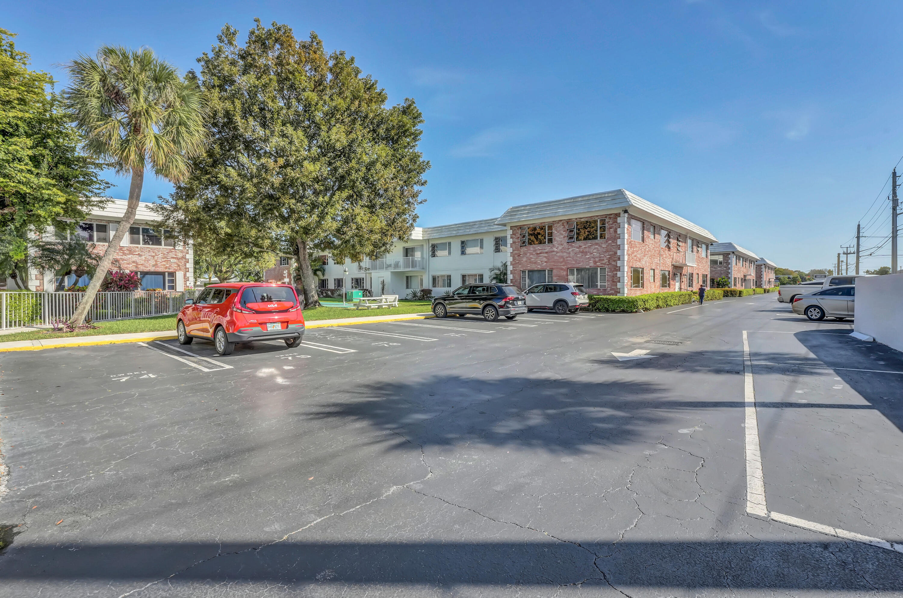 406 South Cypress Road, Unit 330 Pompano Beach, FL 33060 - Photo 37 of 38 a car parked on the side of the road