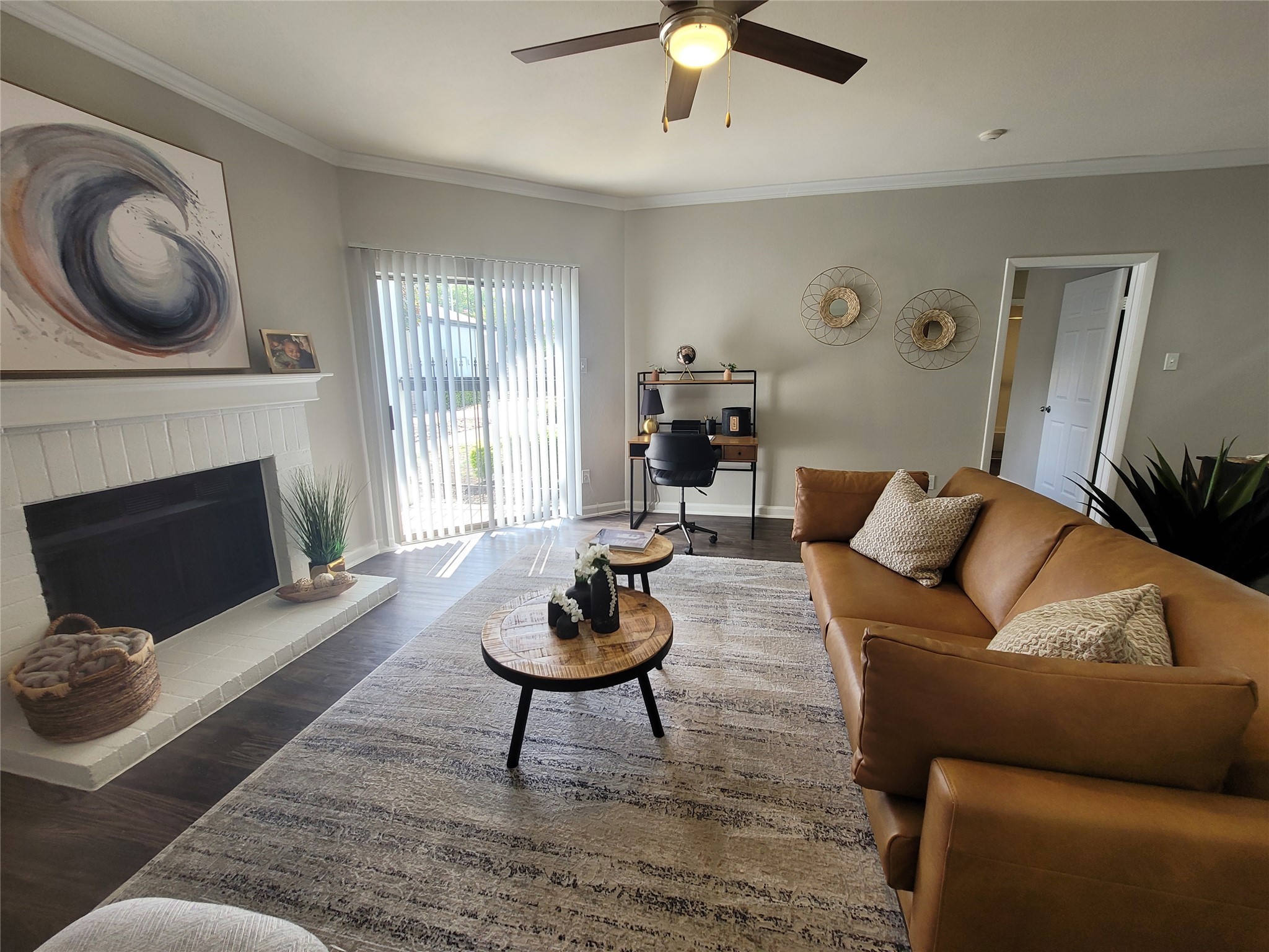 7250 West Greens Road, Unit 515 Houston, TX 77064 - Photo 3 of 12 a living room with furniture a rug and a fireplace