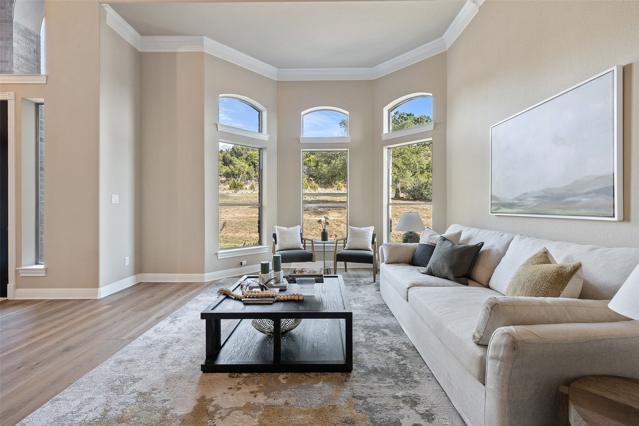 2702 Lakehurst Road Spicewood, TX 78669 - Photo 19 of 40 a living room with furniture and floor to ceiling windows