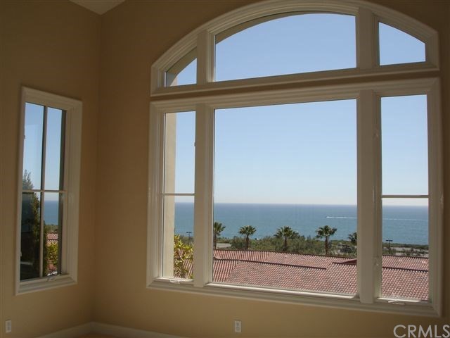 64 Sidra Cove Newport Coast, CA 92657 - Photo 3 of 16 a front view of a house with a window