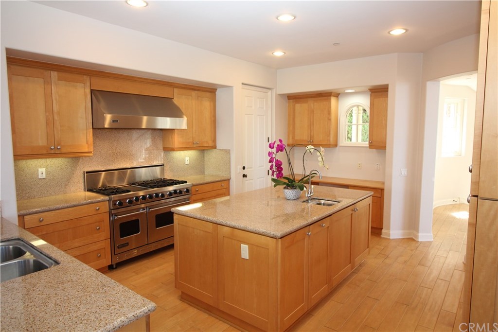 64 Sidra Cove Newport Coast, CA 92657 - Photo 6 of 16 a kitchen with a stove and a sink