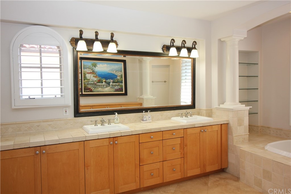 64 Sidra Cove Newport Coast, CA 92657 - Photo 10 of 16 a bathroom with a sink and a mirror