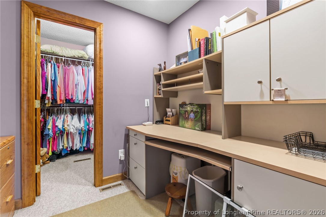 4240 Nicholson Road Cameron, NC 28326 - Photo 14 of 49 a kitchen with a refrigerator and cabinets
