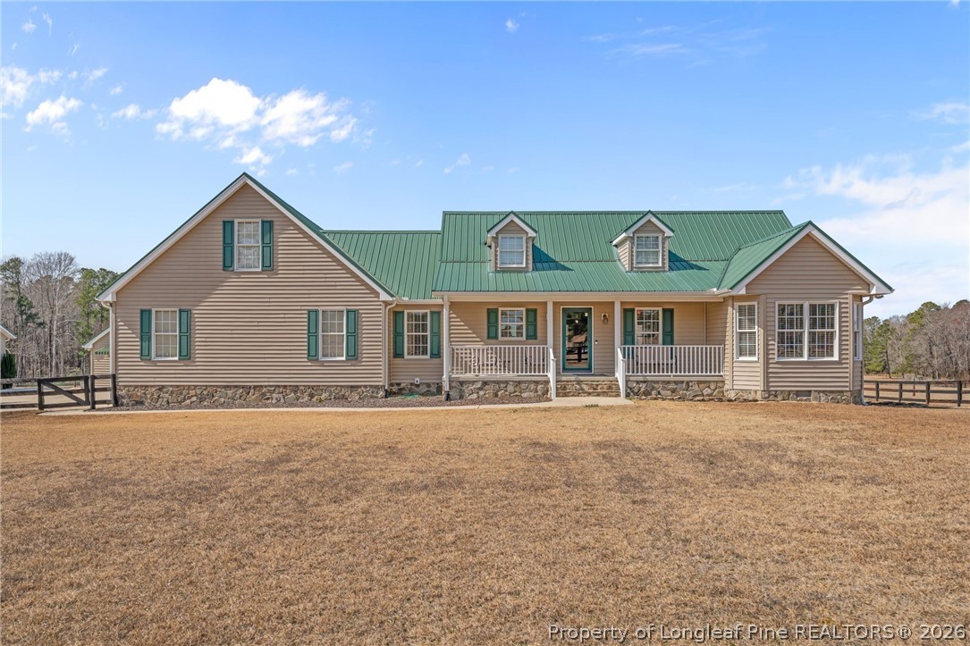 4240 Nicholson Road Cameron, NC 28326 - Photo 2 of 49 a front view of a house with a yard