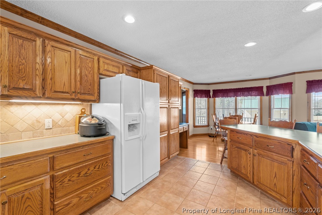 4240 Nicholson Road Cameron, NC 28326 - Photo 24 of 49 a kitchen with a refrigerator and a sink