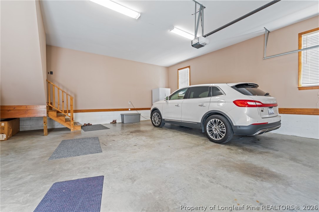 4240 Nicholson Road Cameron, NC 28326 - Photo 32 of 49 a car parked in a parking garage