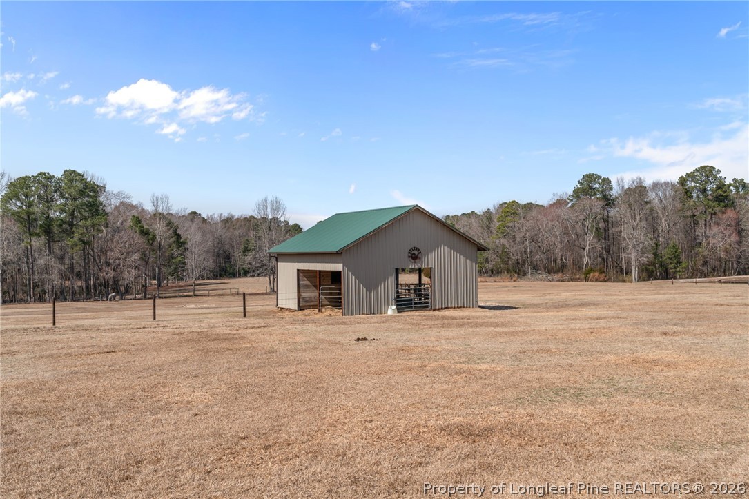 4240 Nicholson Road Cameron, NC 28326 - Photo 39 of 49 a view of a house with a yard