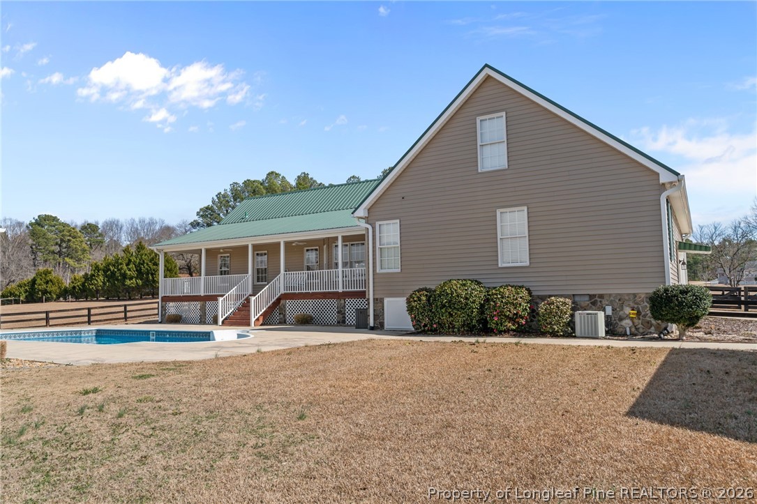 4240 Nicholson Road Cameron, NC 28326 - Photo 40 of 49 a front view of a house with a yard