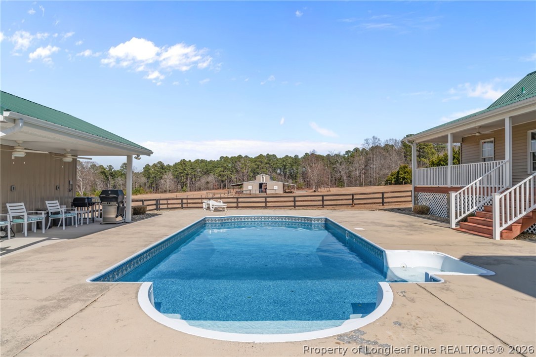 4240 Nicholson Road Cameron, NC 28326 - Photo 41 of 49 a view of a swimming pool with lounge chair