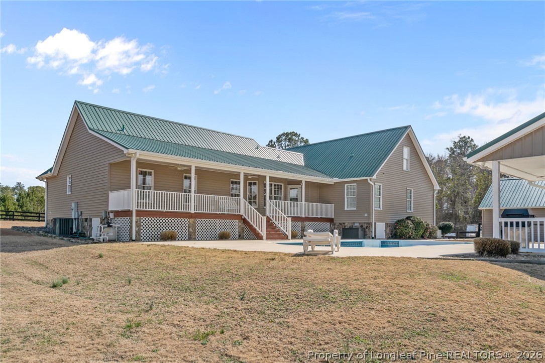 4240 Nicholson Road Cameron, NC 28326 - Photo 42 of 49 a front view of a house with a yard